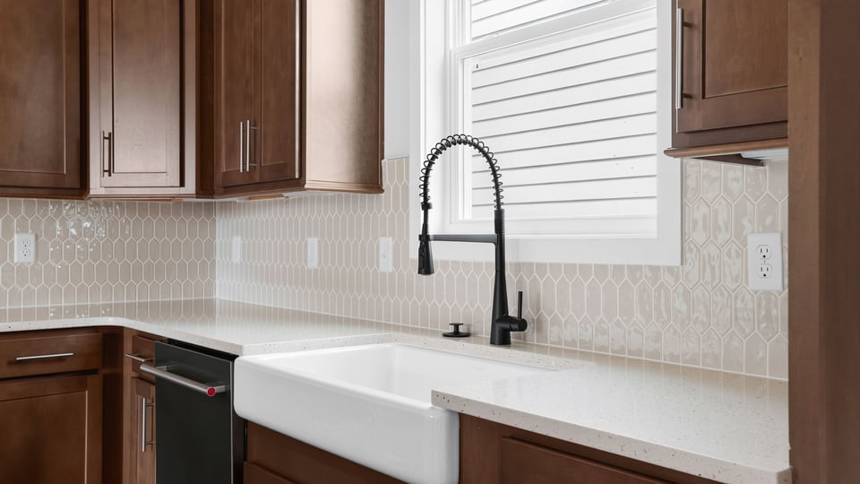 Kitchen with island and cabinets.
