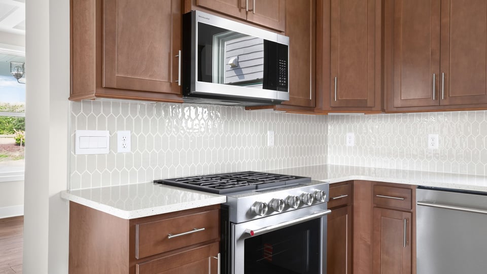 Kitchen with island and cabinets.