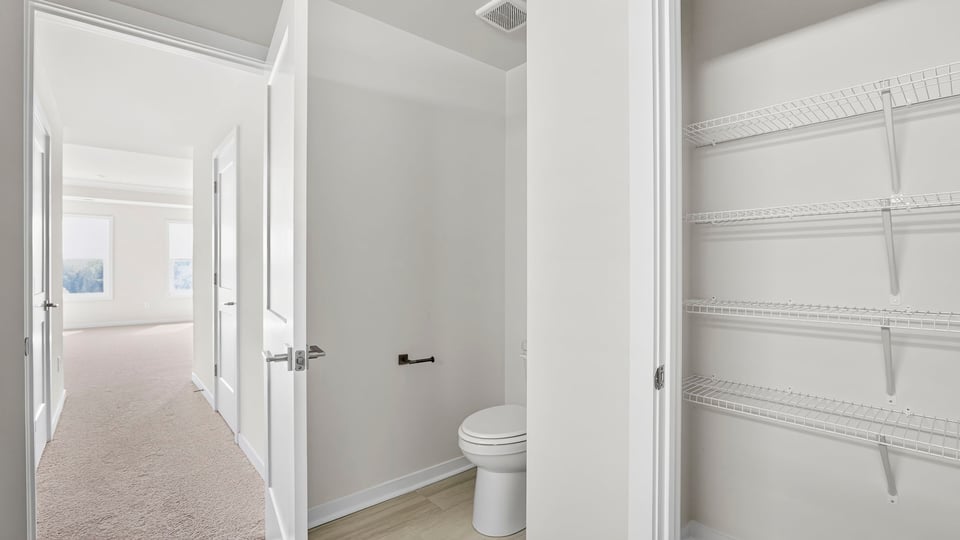 Hallway to primary bathroom.