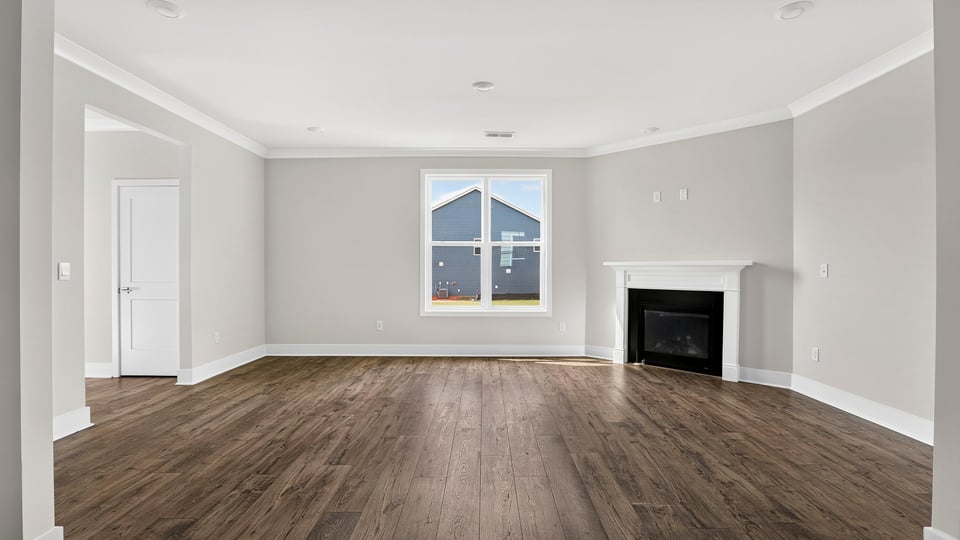 Living area with windows and fireplace.