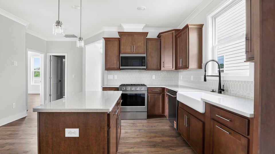 Kitchen with island and cabinets.