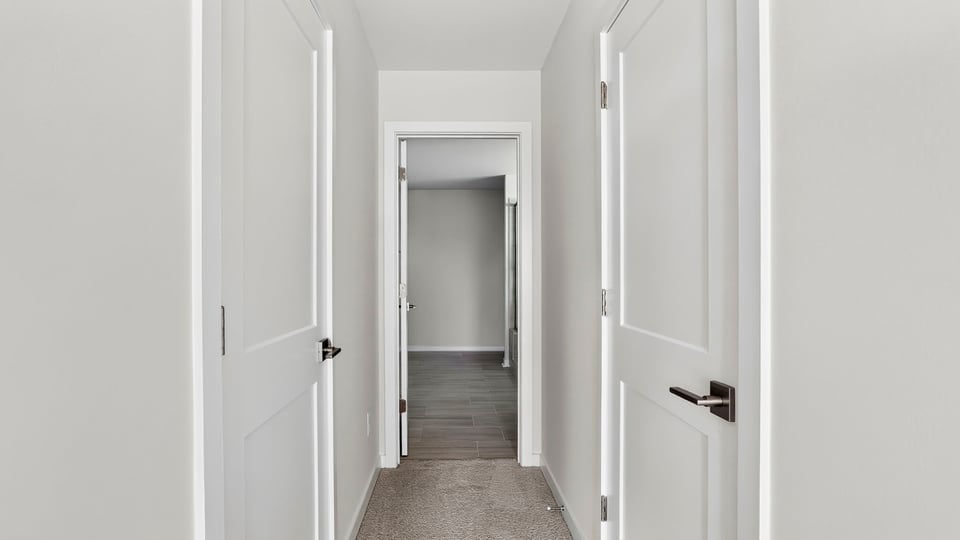 Hallway to primary bathroom.