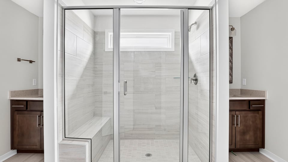 Primary bathroom with double vanity sinks.