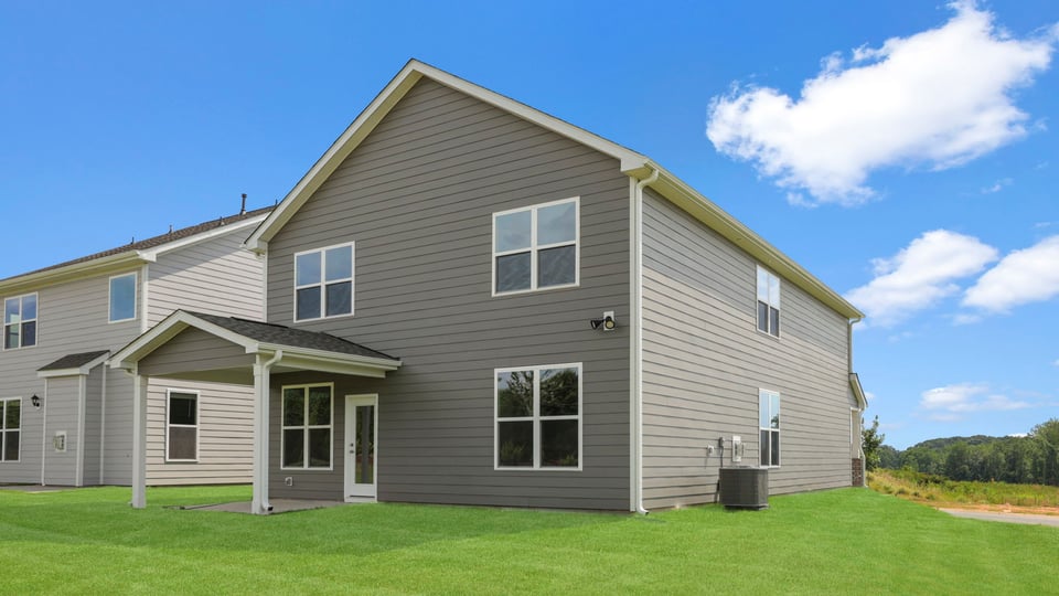 Back exterior with large backyard.