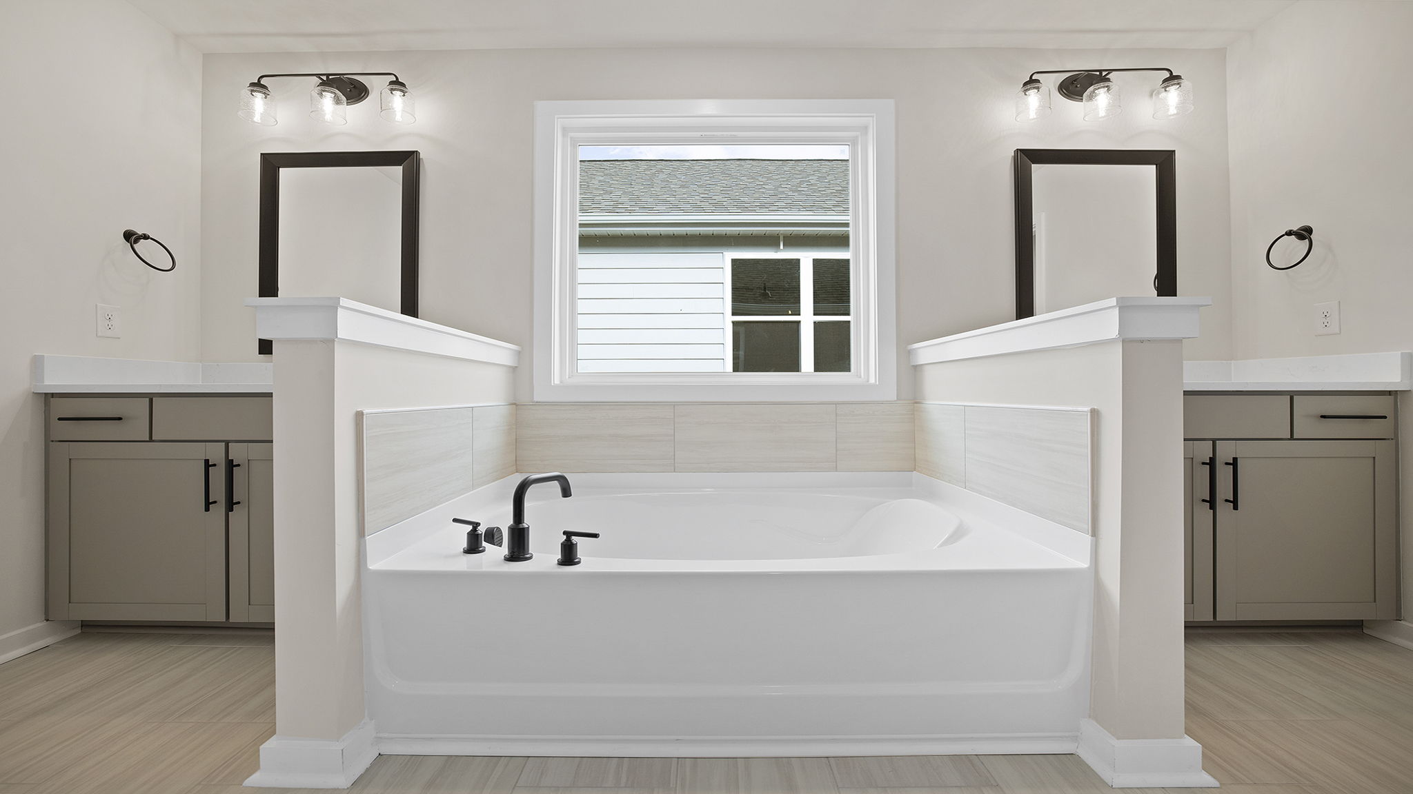 Primary bathroom with tub and walk-in shower.