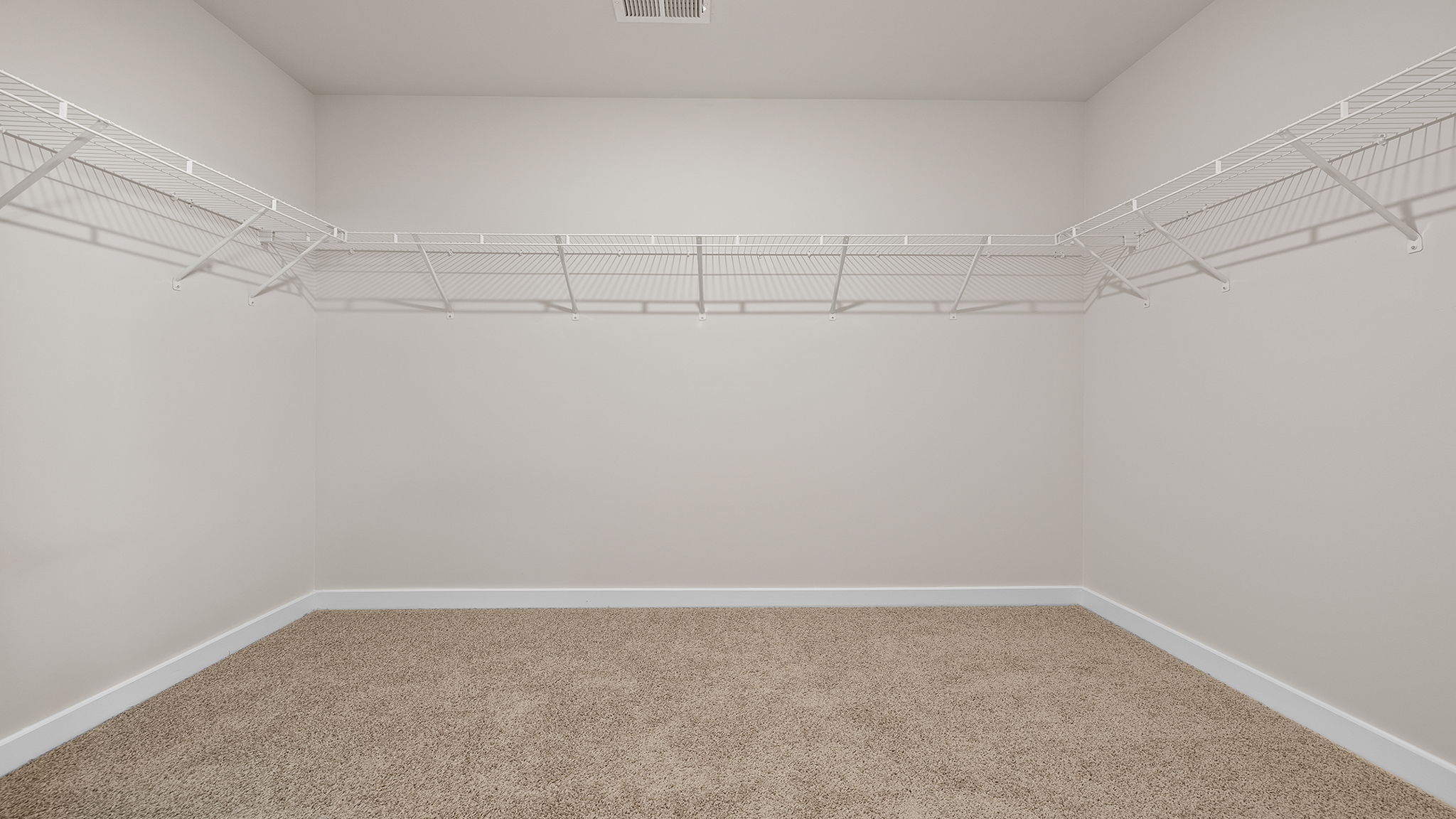 Primary bedroom walk-in closet.