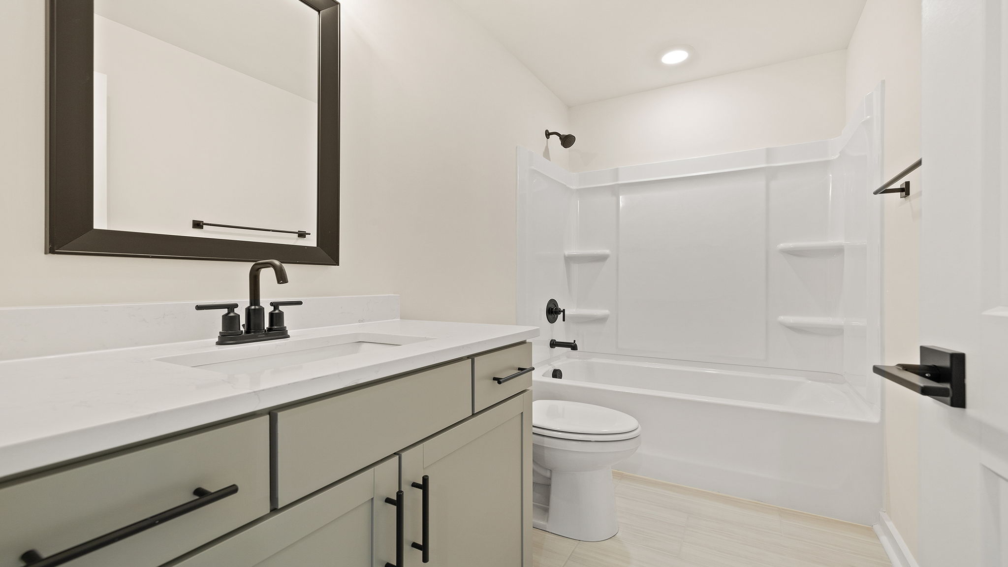 Bathroom with vanity and tub.