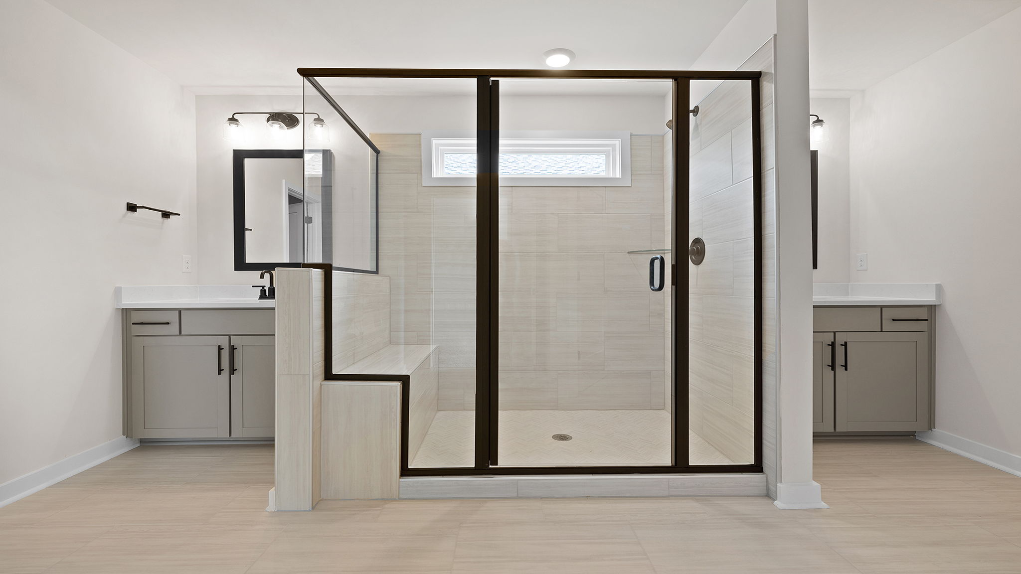 Bathroom with vanity and shower.