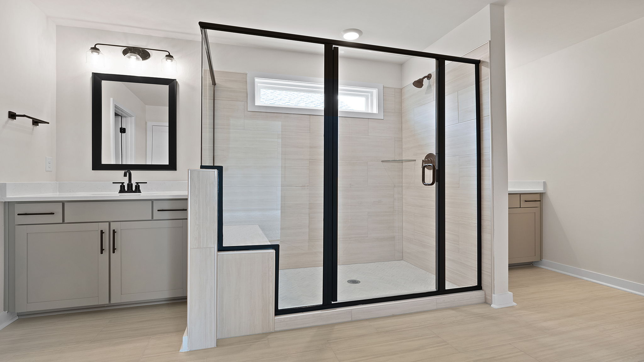 Bathroom with vanity and shower.
