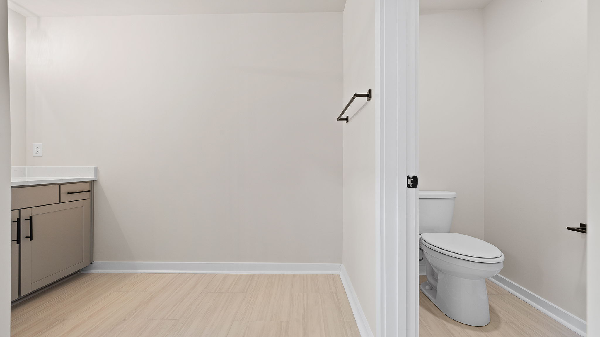 Bathroom with vanity and shower.