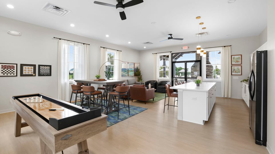 Living area of clubhouse with windows.