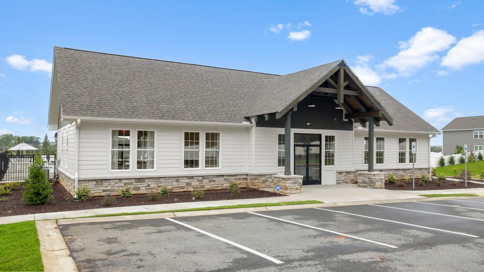 Clubhouse amenity exterior with parking.