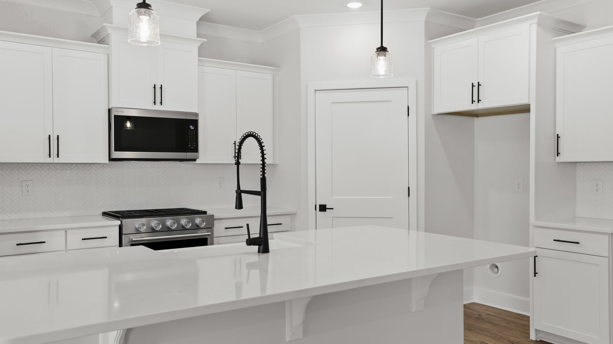 Kitchen with island and cabinets.