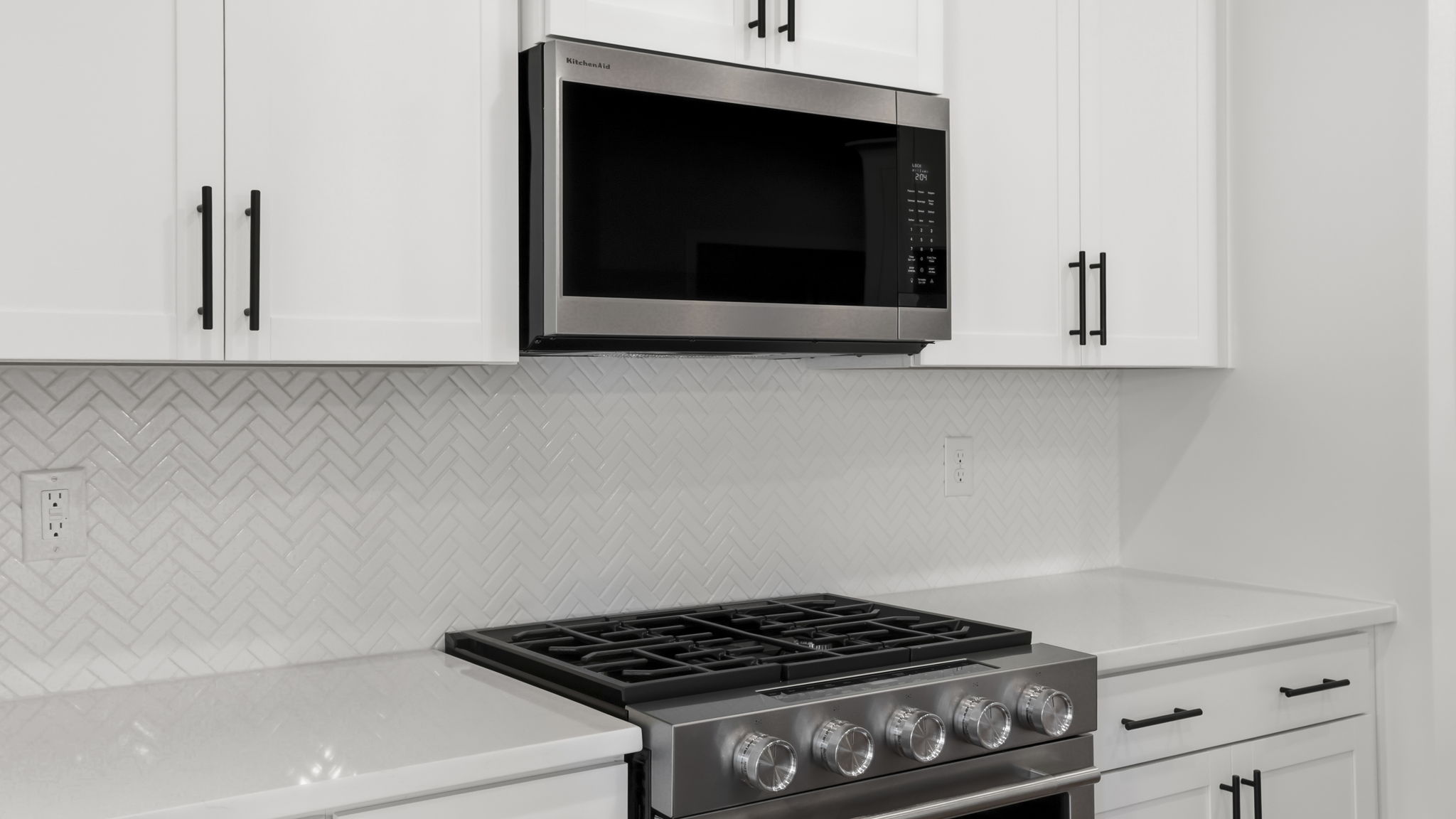 Kitchen with island and cabinets.
