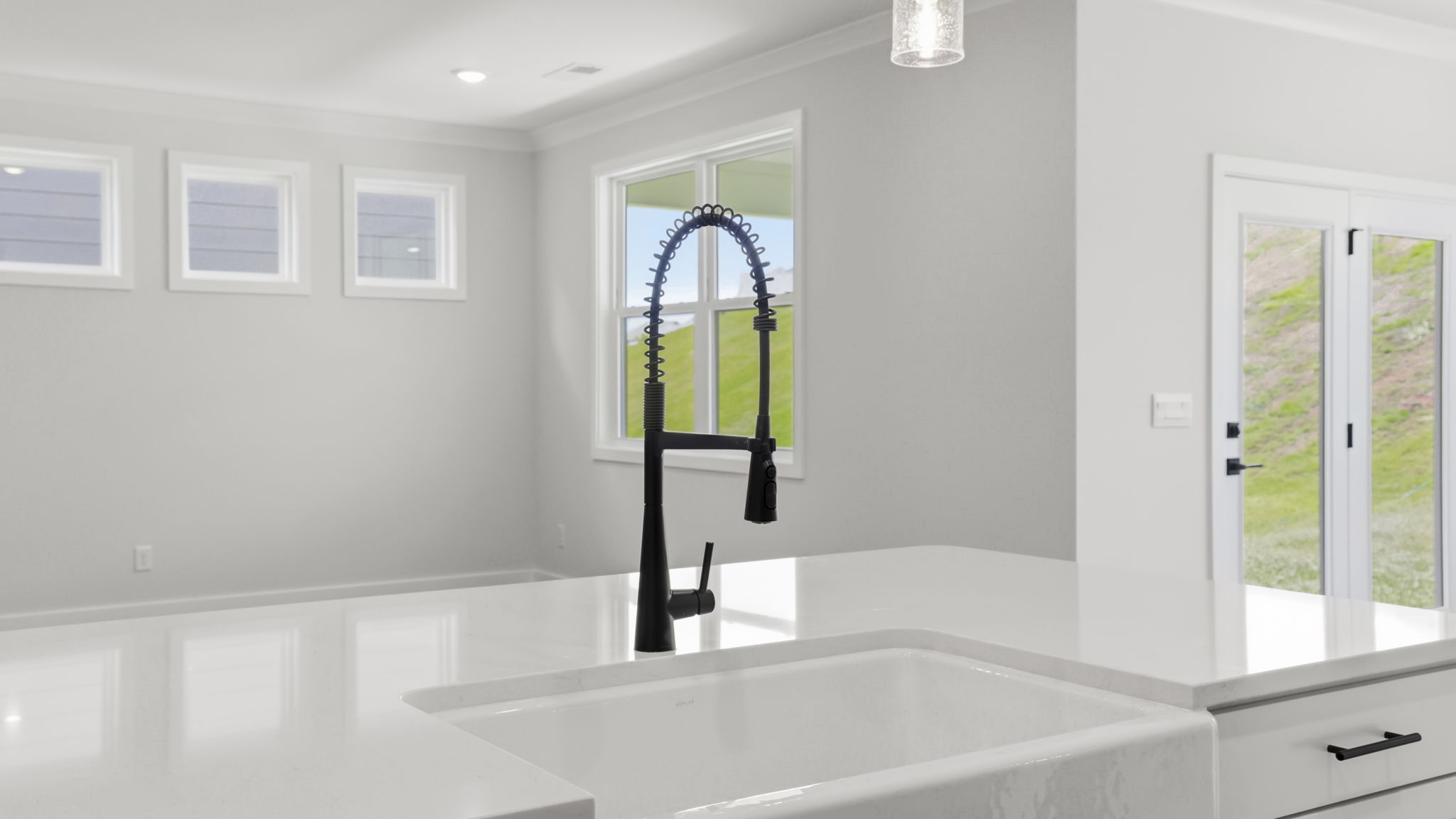Kitchen with island and cabinets.