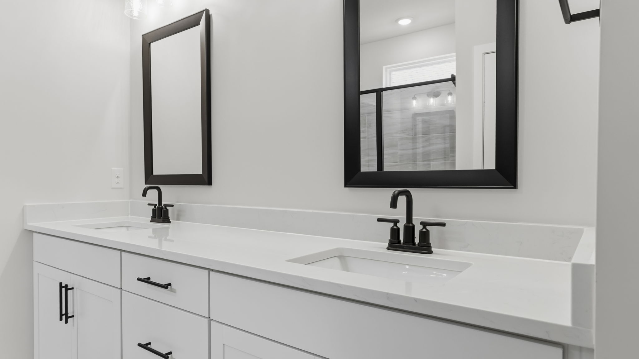 Primary bathroom with double vanity sinks.