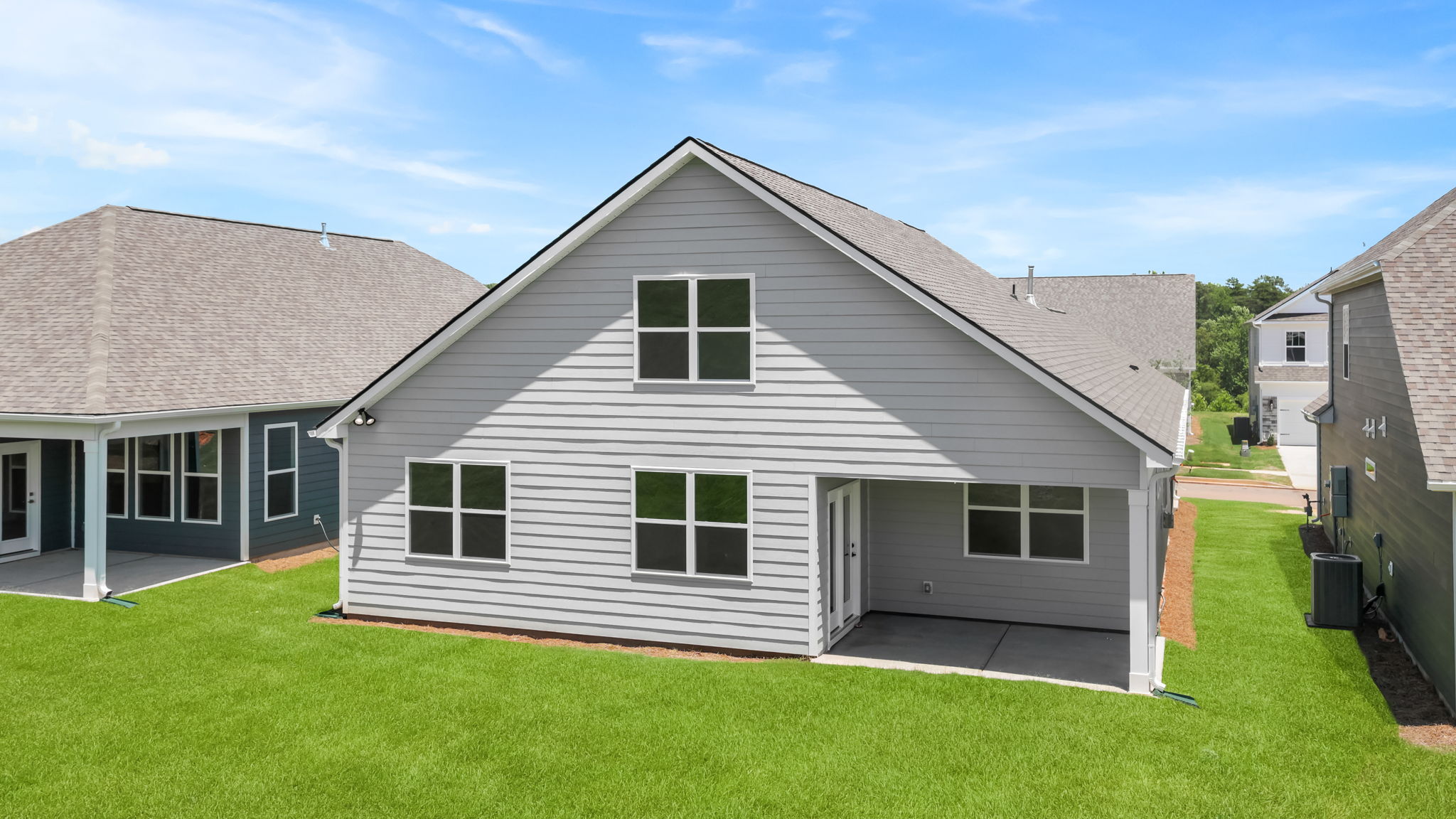 Back exterior with large backyard.