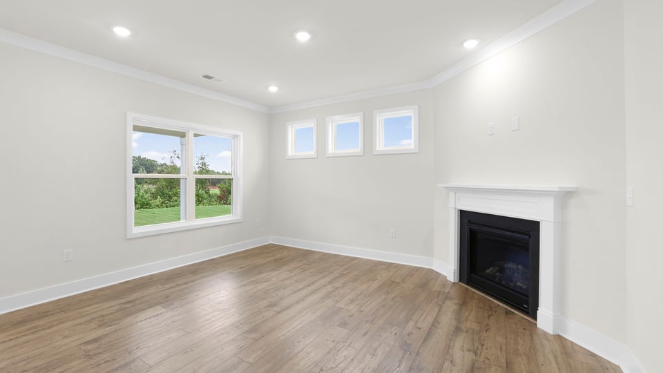 Living room with window and fireplace.