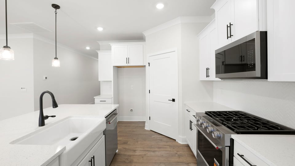Kitchen with island and cabinets.