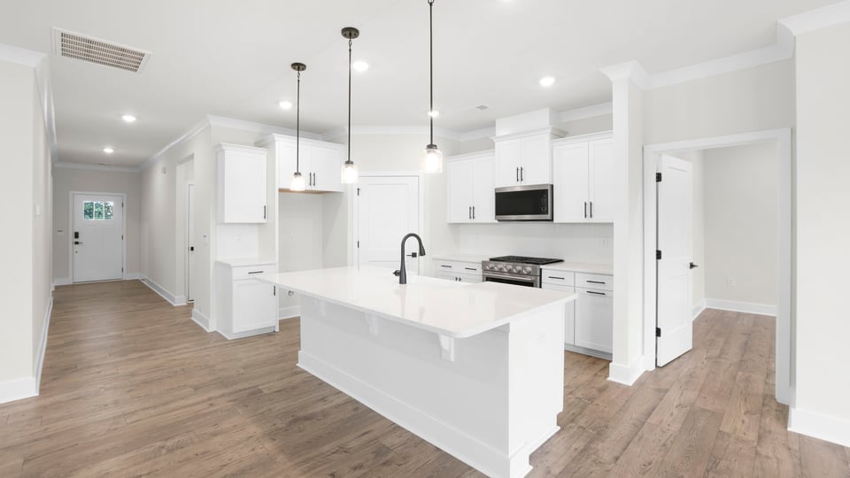 Kitchen with island and cabinets.