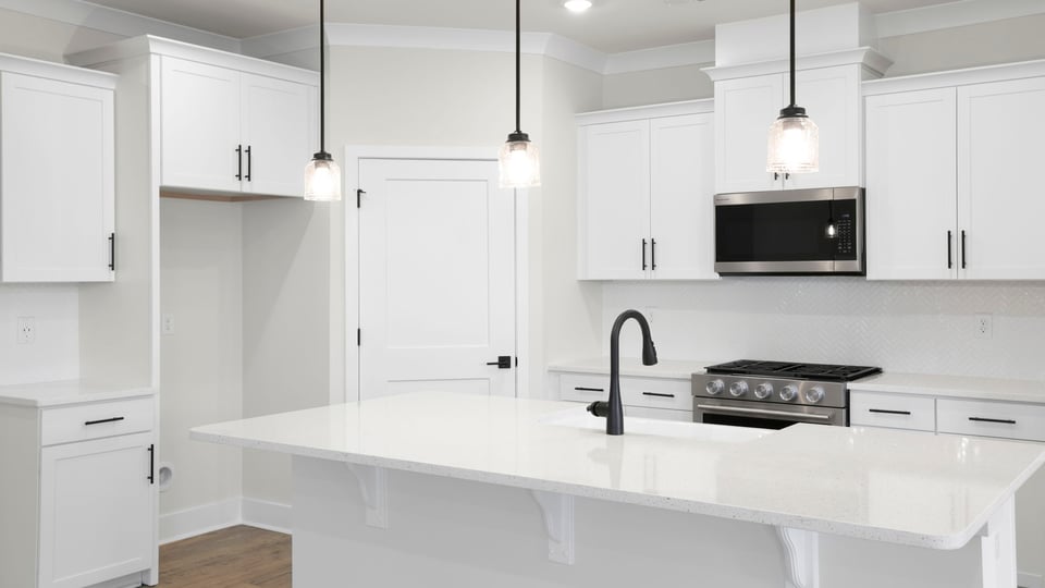 Kitchen with island and cabinets.