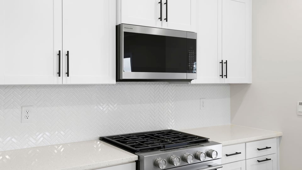 Kitchen with island and cabinets.
