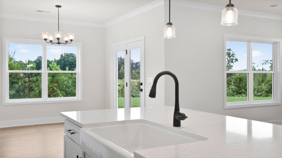 Kitchen with island and cabinets.
