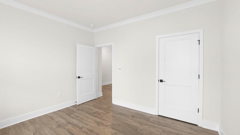 Bedroom with window and closet.