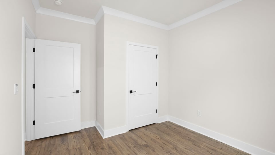 Bedroom with window and closet.