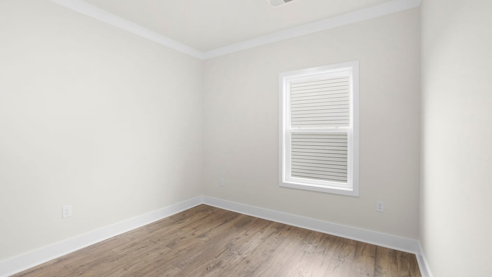Bedroom with window and closet.