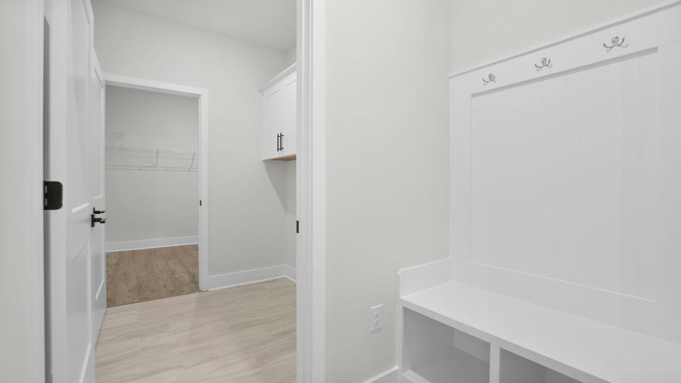 Laundry room with shelf.