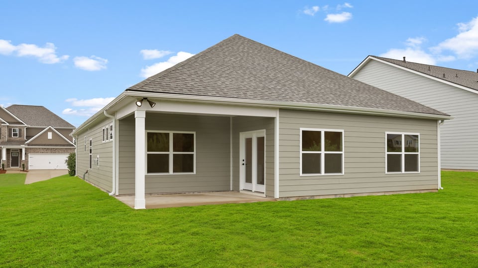 Back exterior with large backyard.