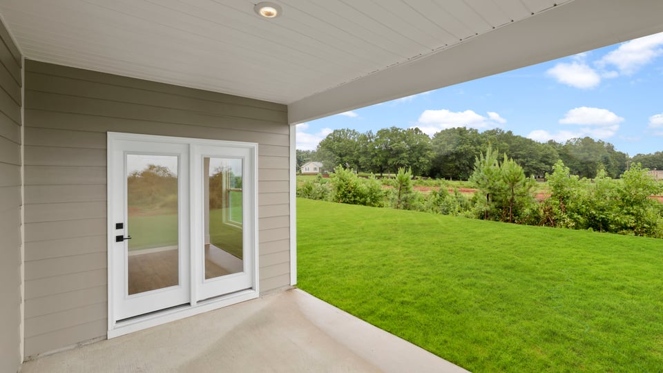 Back exterior with large backyard.