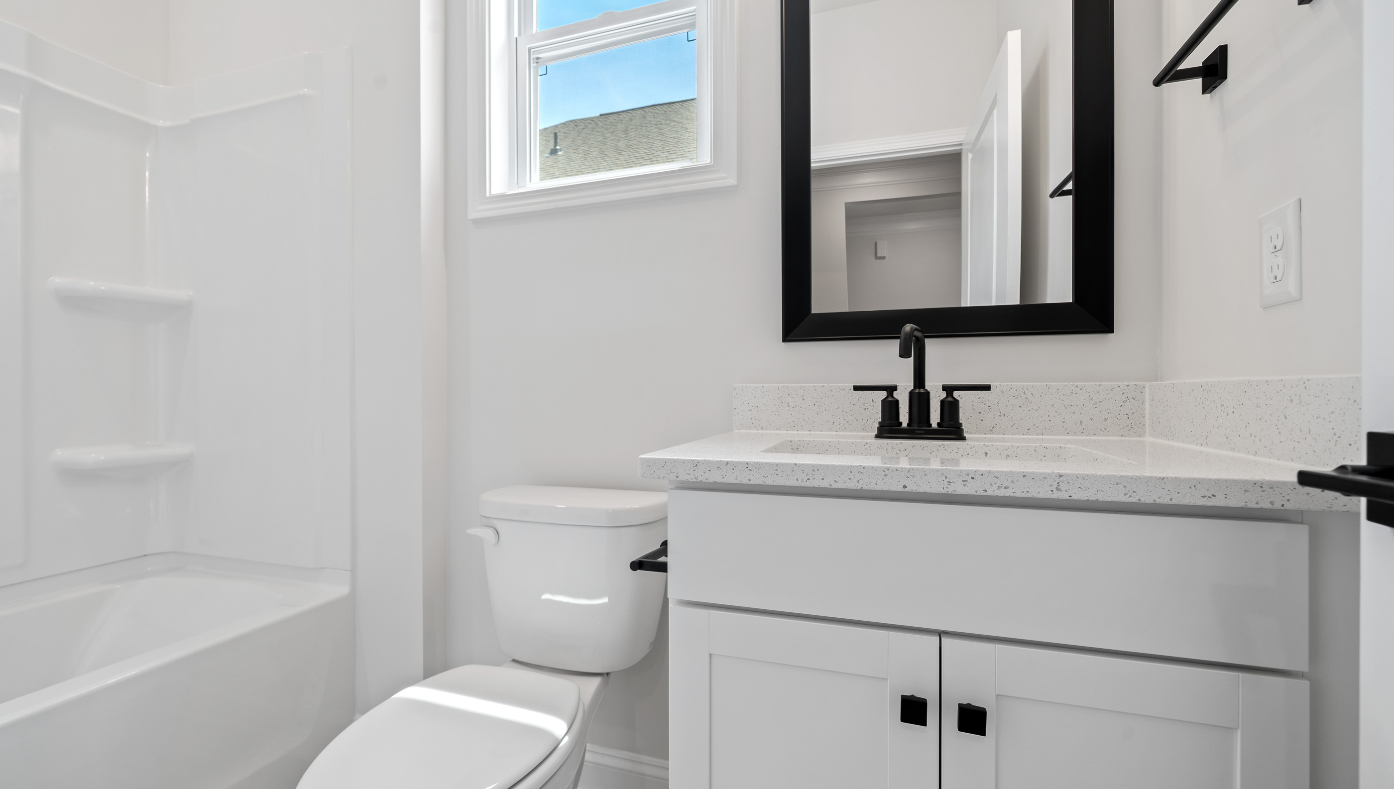 Bathroom with sink and tub.