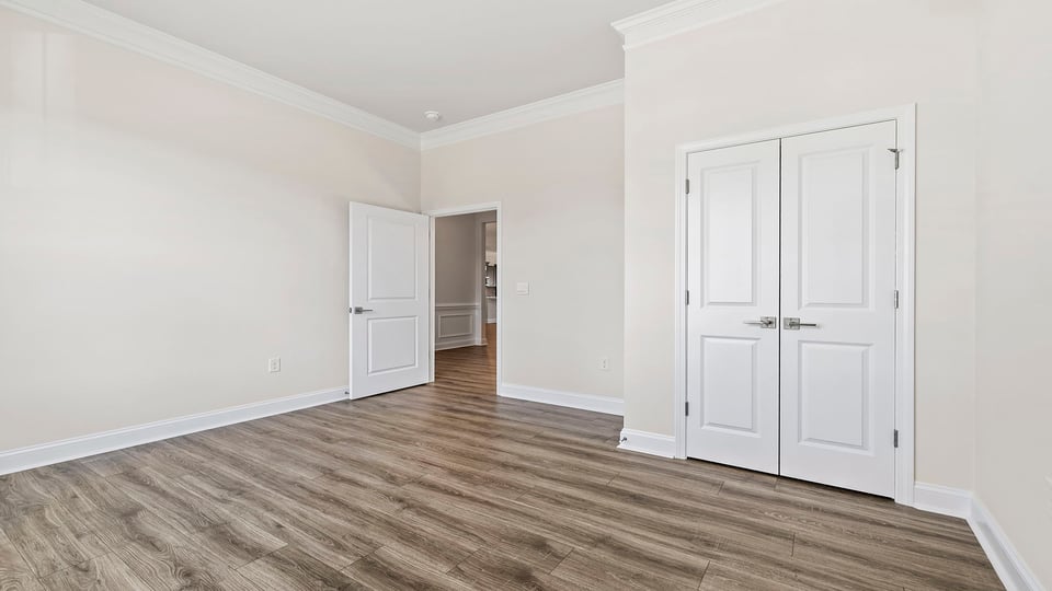 Bedroom with window and closet.