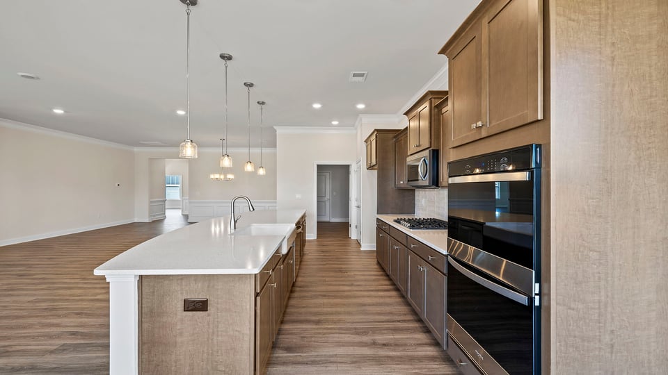 Kitchen with island and cabinets.