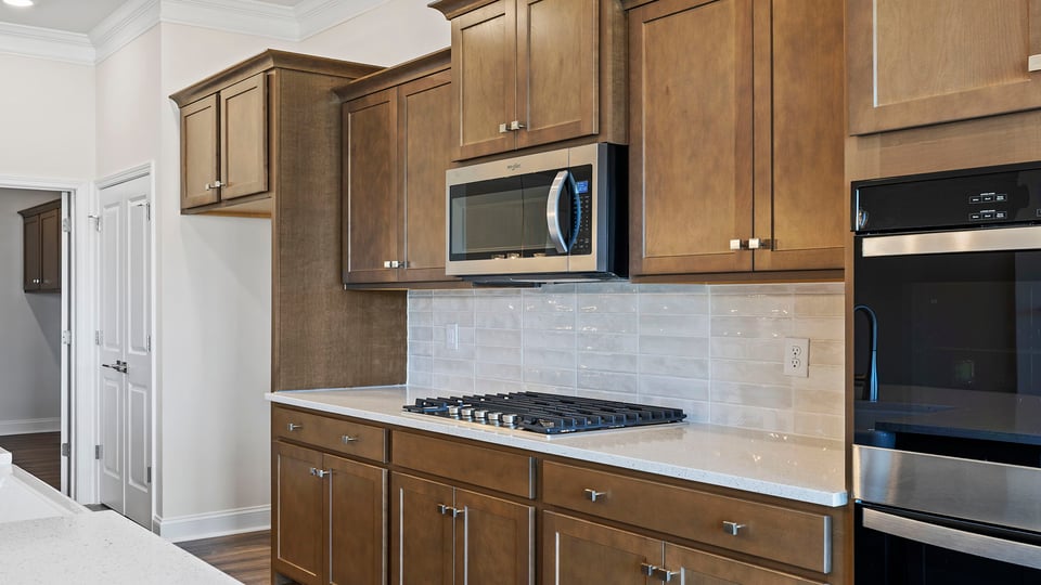 Kitchen with island and cabinets.