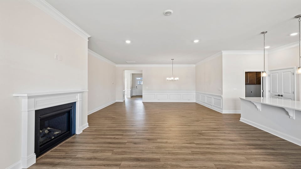 Living room with windows and fireplace.