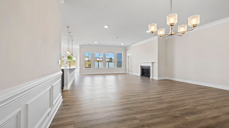 Living room with windows and fireplace.
