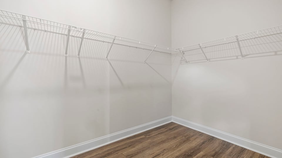 Primary closet with shelf.