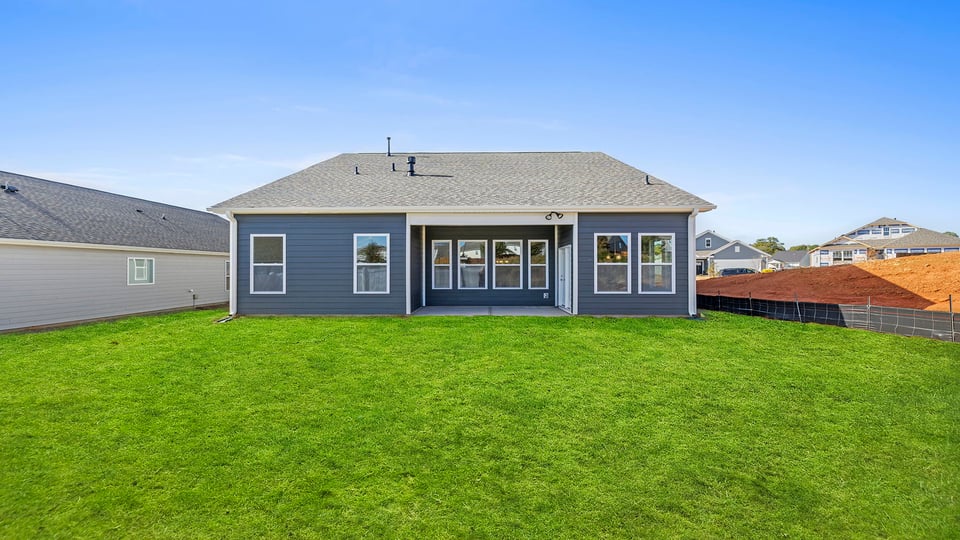 Back exterior with large backyard.a