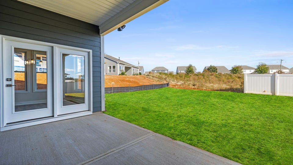 Back exterior with large backyard.