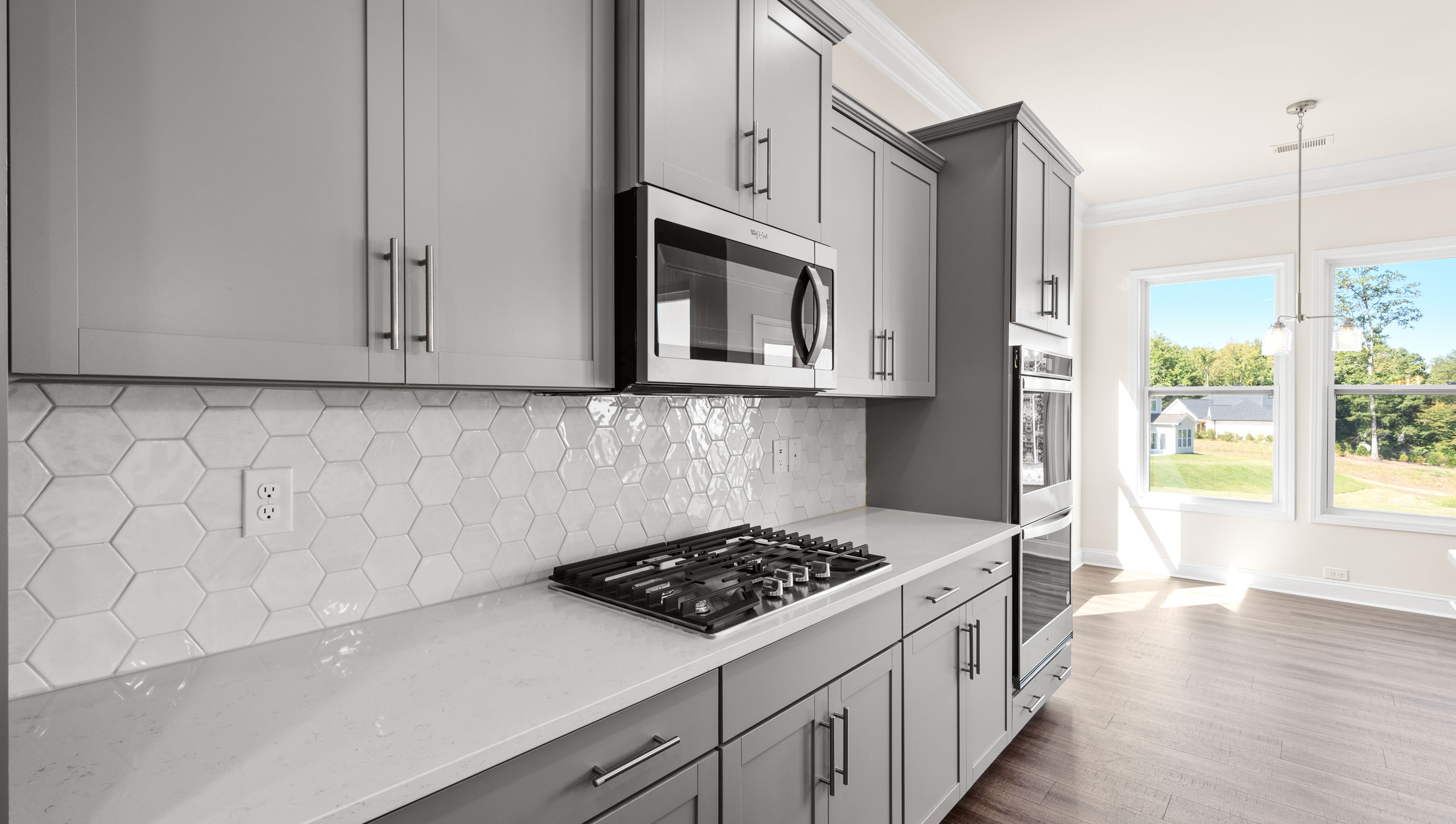 Gas cooktop and built in microwave.