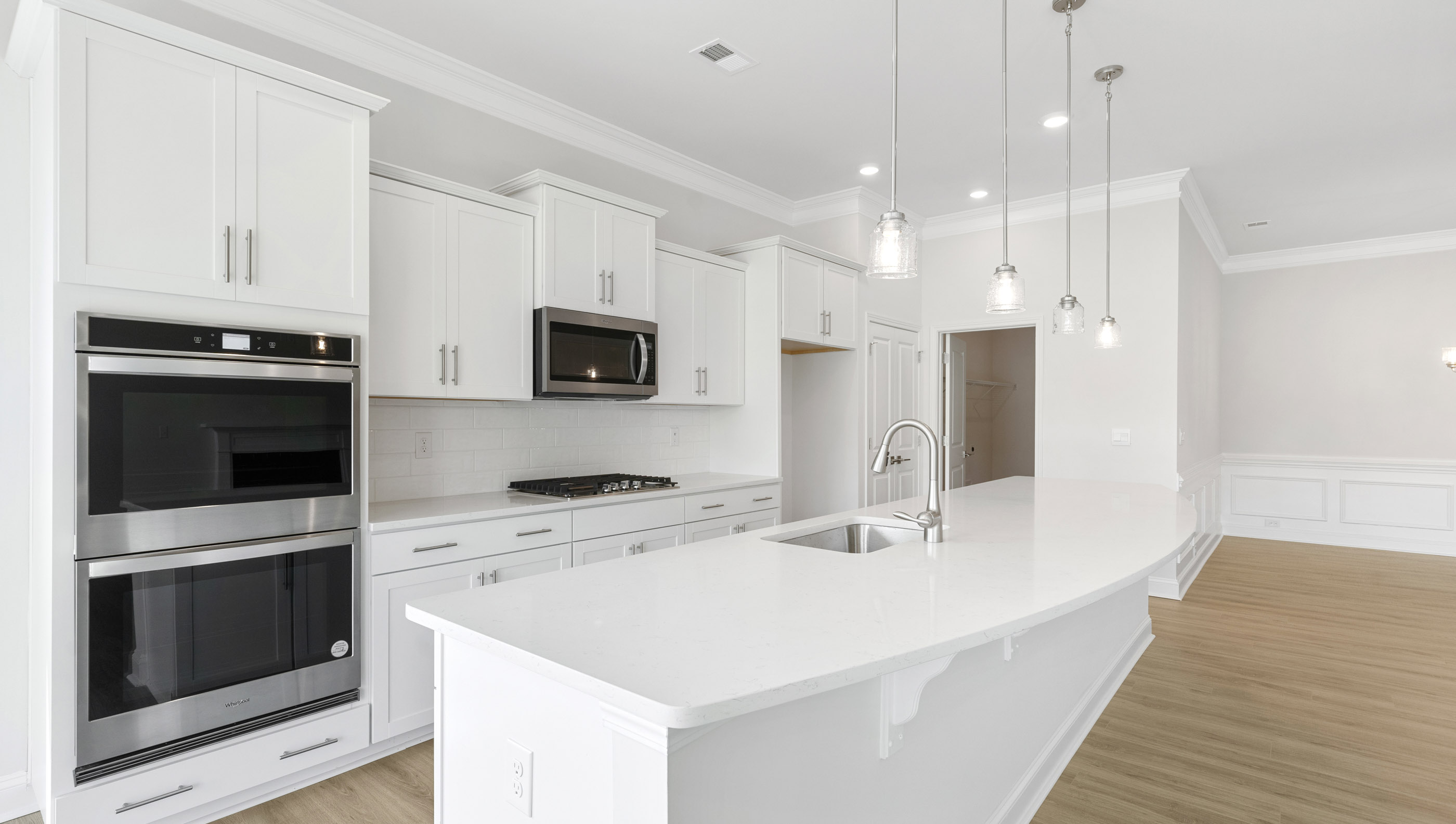 Kitchen with island and cabinets.