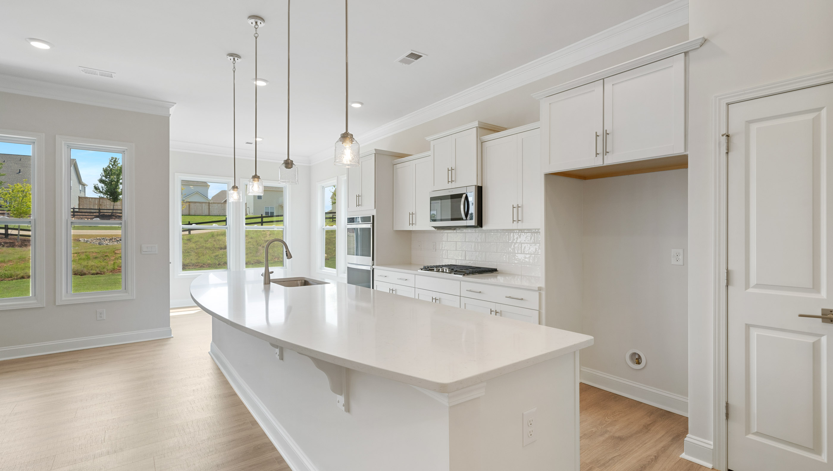 Kitchen with island and cabinets.