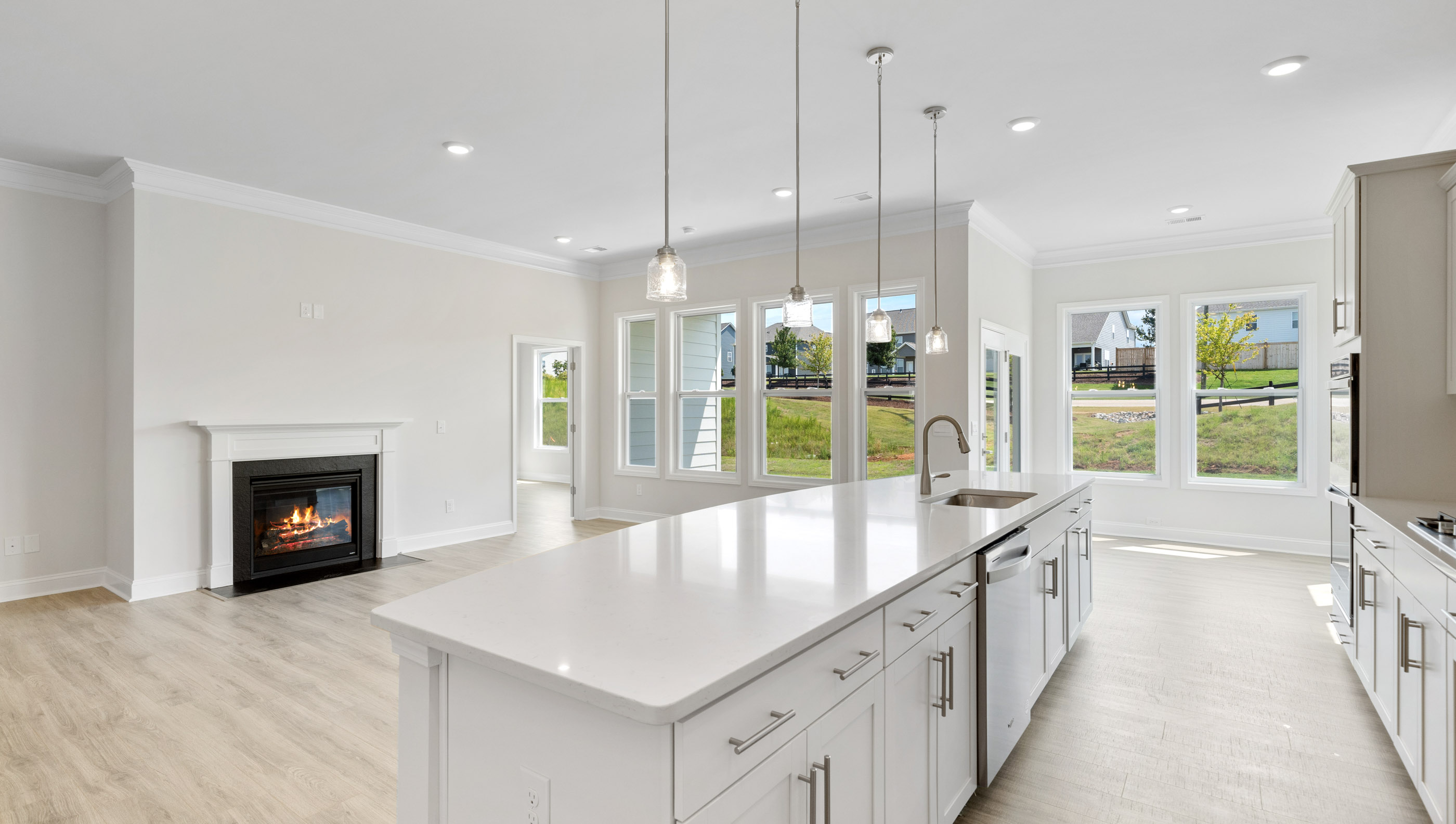Kitchen with island and cabinets.