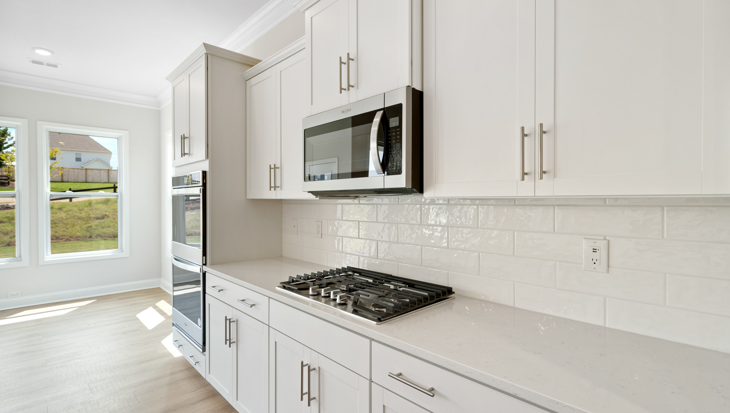 Kitchen with island and cabinets.