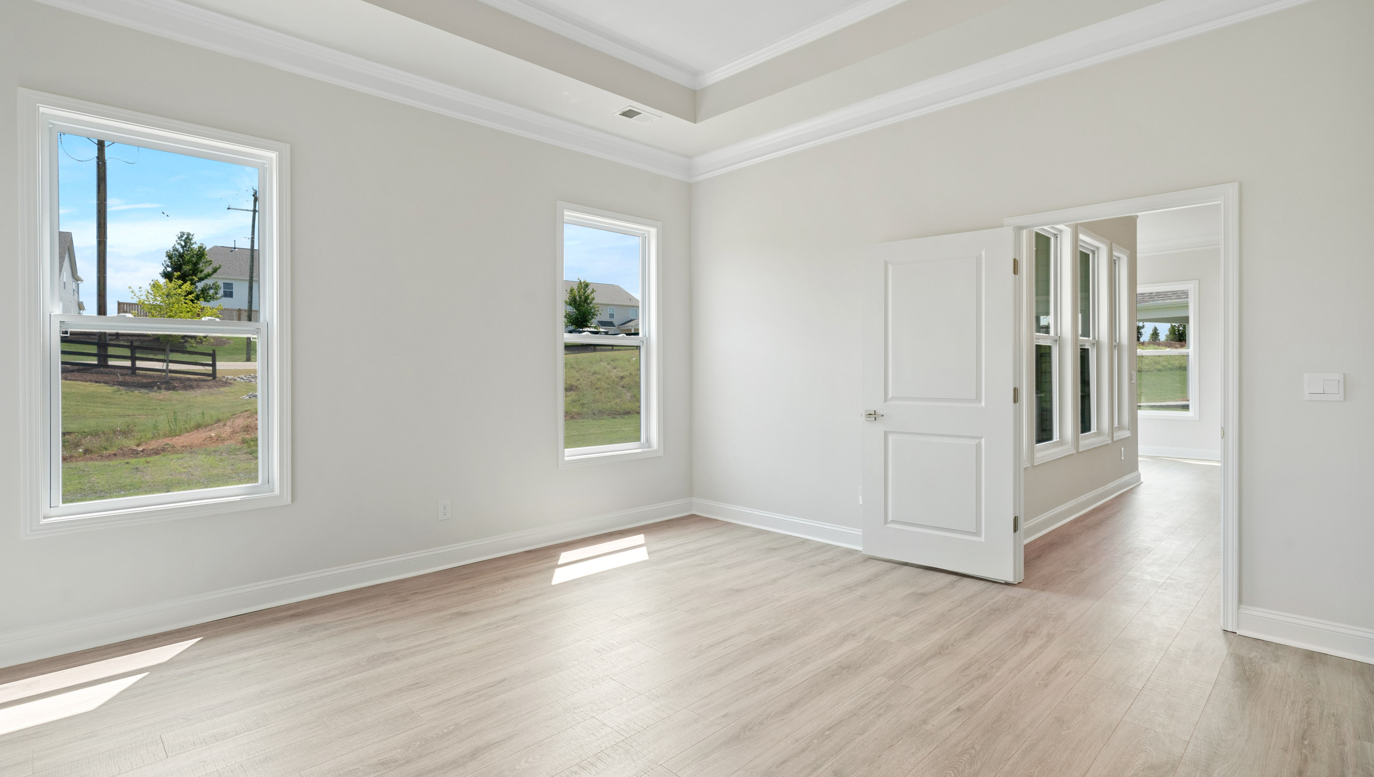 Primary bedroom with window.