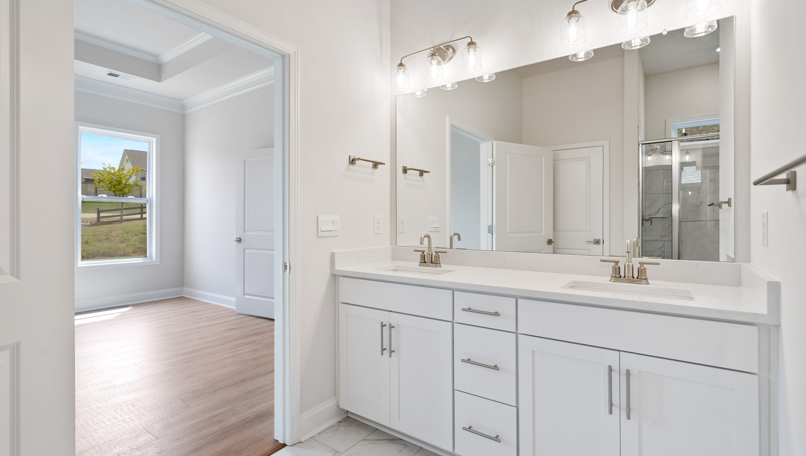 Primary bathroom with double vanity sinks.
