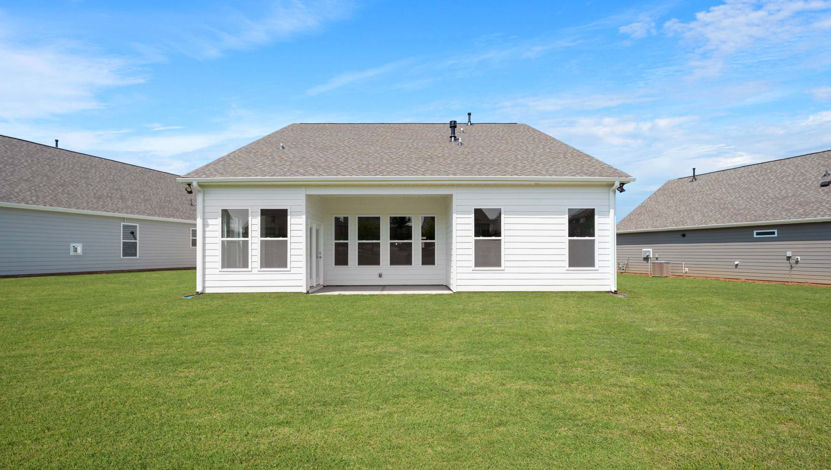 Back exterior with large backyard.